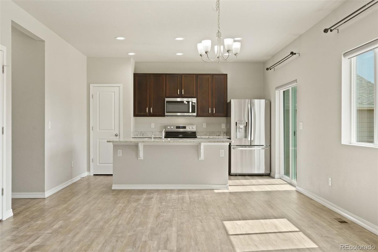 Chandelier, Interior, Kitchen, Pendant Lights, Recessed Lighting, Stainless Steel Appliances, Wood Texture Flooring
