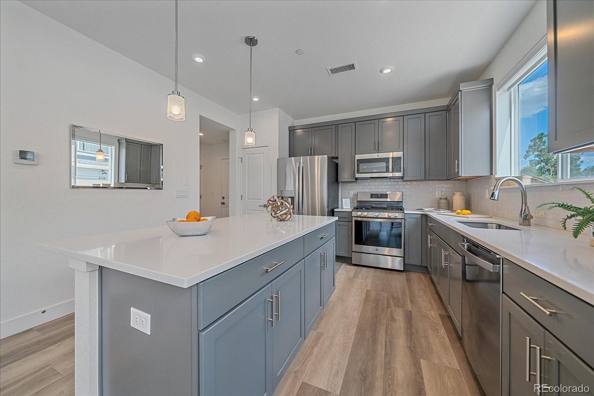 Interior, Kitchen, Pendant Lights, Recessed Lighting, Stainless Steel Appliances, Wood Texture Flooring