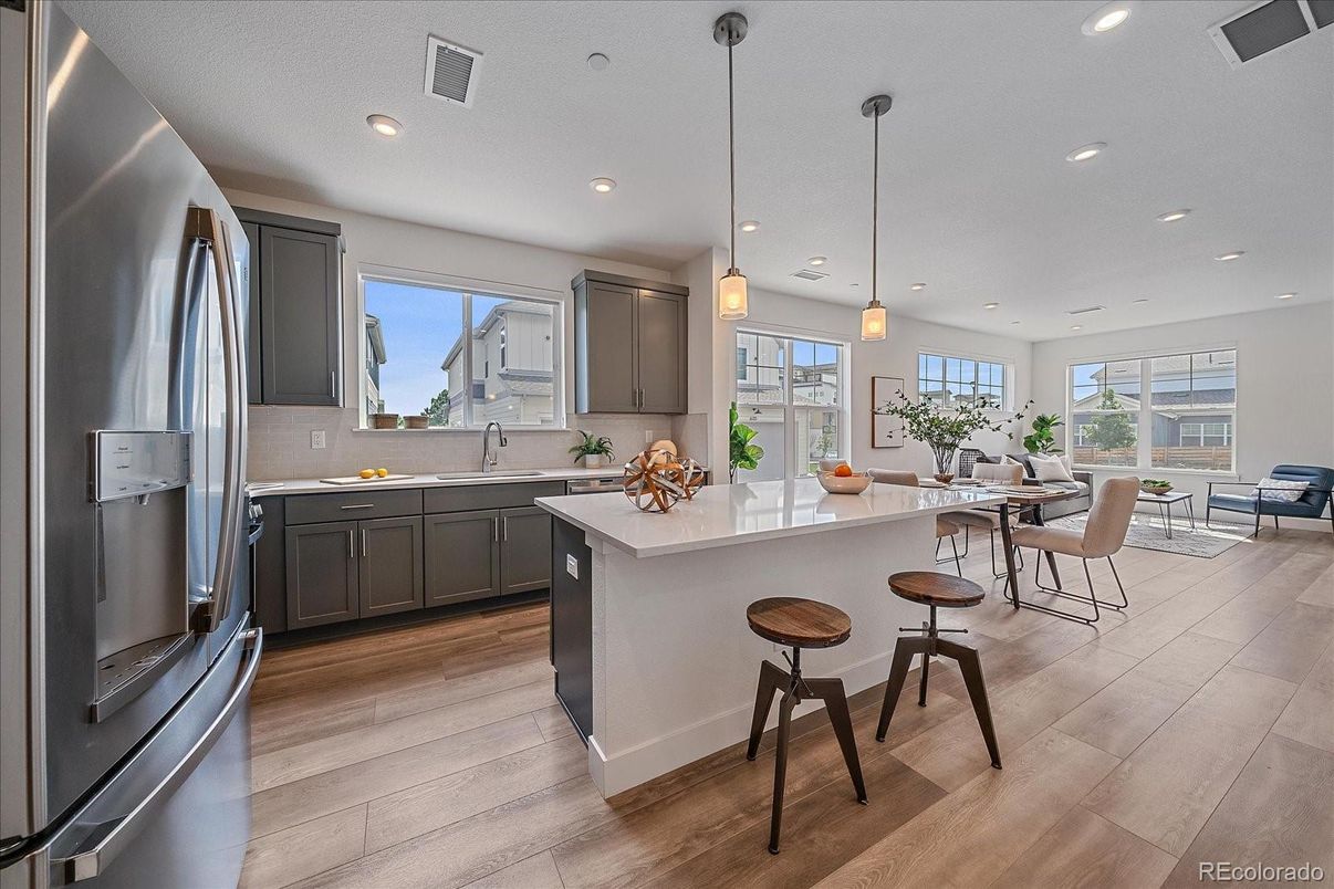 Dining room, Interior, Kitchen, Pendant Lights, Recessed Lighting, Stainless Steel Appliances, Wood Texture Flooring