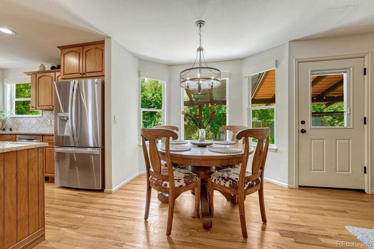 Dining room, Interior, Kitchen, Pendant Lights, Recessed Lighting, Stainless Steel Appliances, Wood Texture Flooring