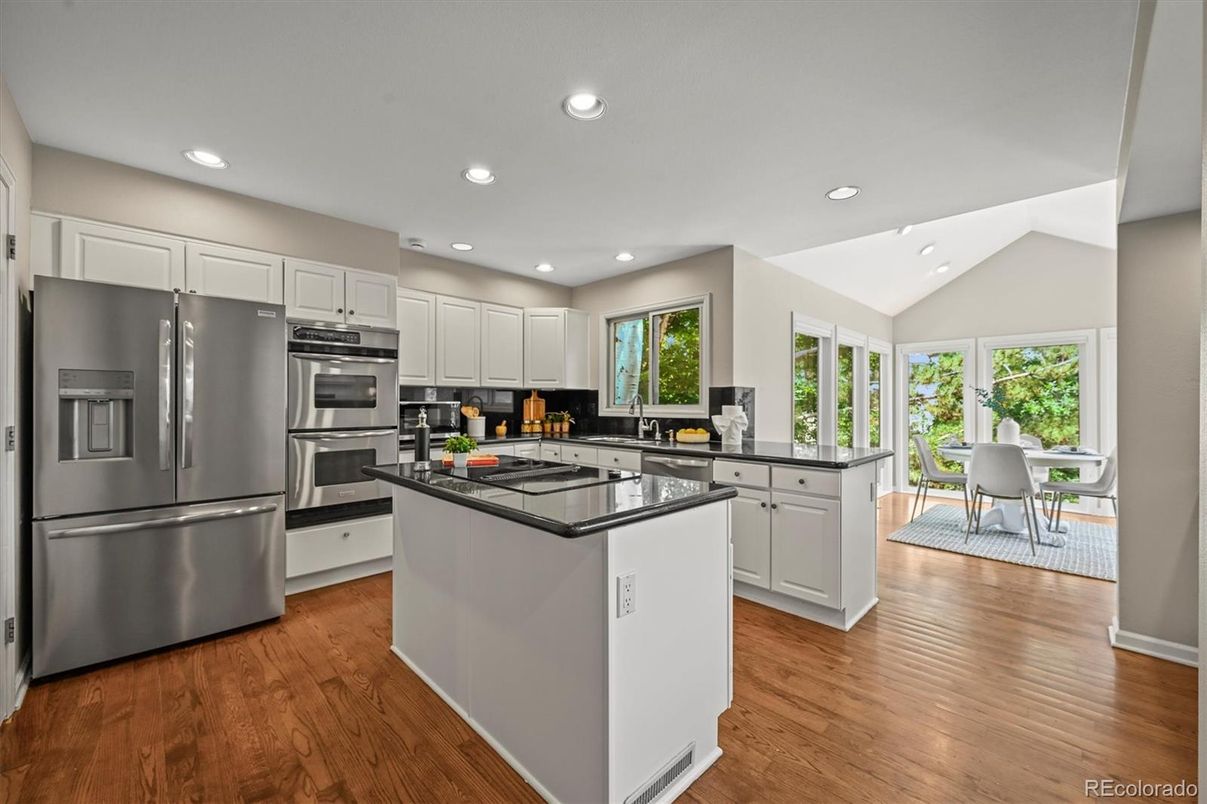Dining room, Interior, Kitchen, Recessed Lighting, Stainless Steel Appliances, Wood Texture Flooring