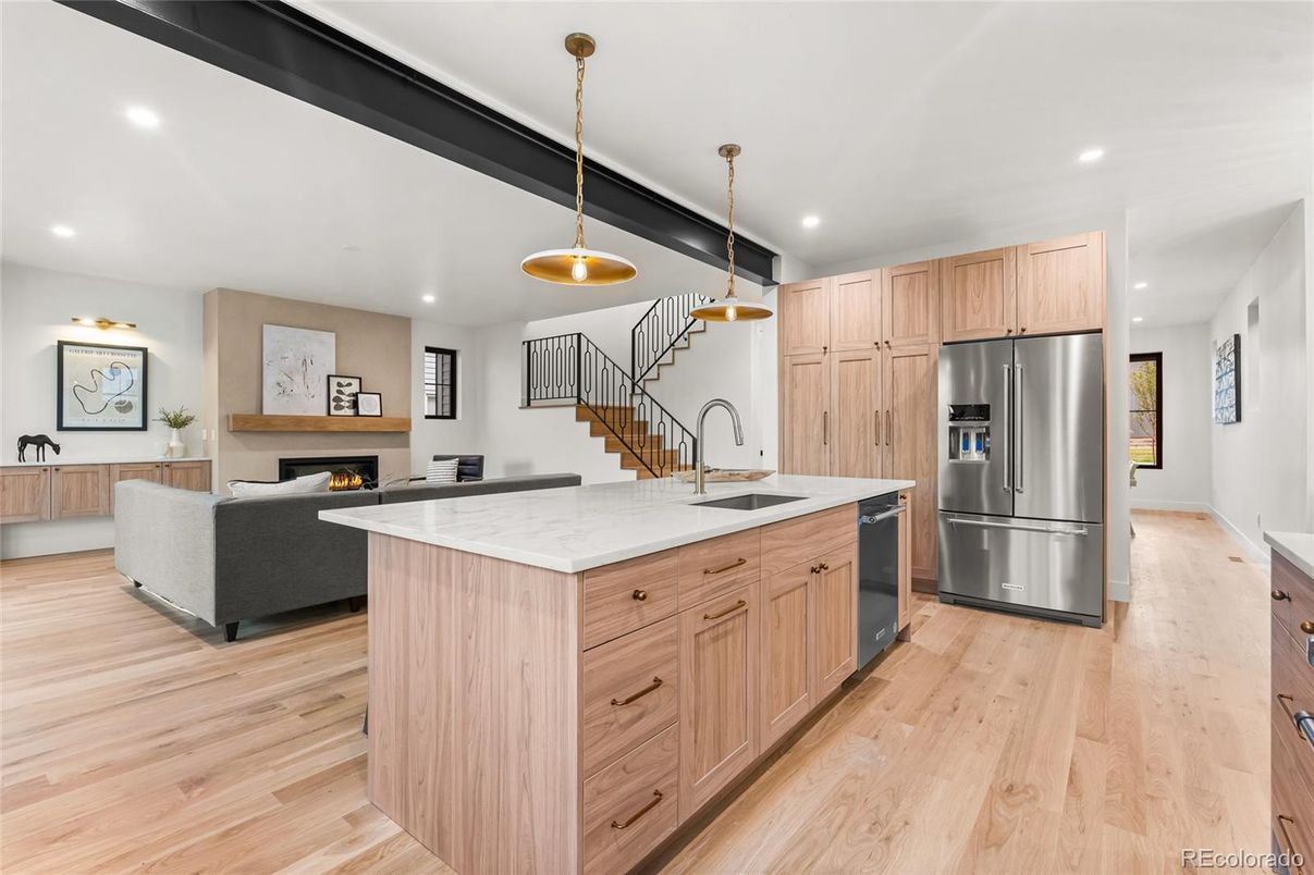Fireplace, Interior, Kitchen, Living room, Pendant Lights, Recessed Lighting, Stainless Steel Appliances, Wood Texture Flooring