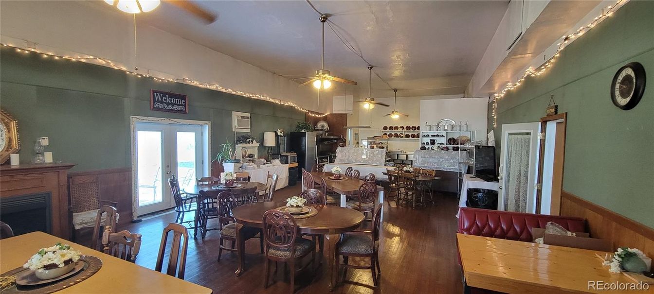 Dining room, Fireplace, Interior, Kitchen, Pendant Lights, Wood Texture Flooring