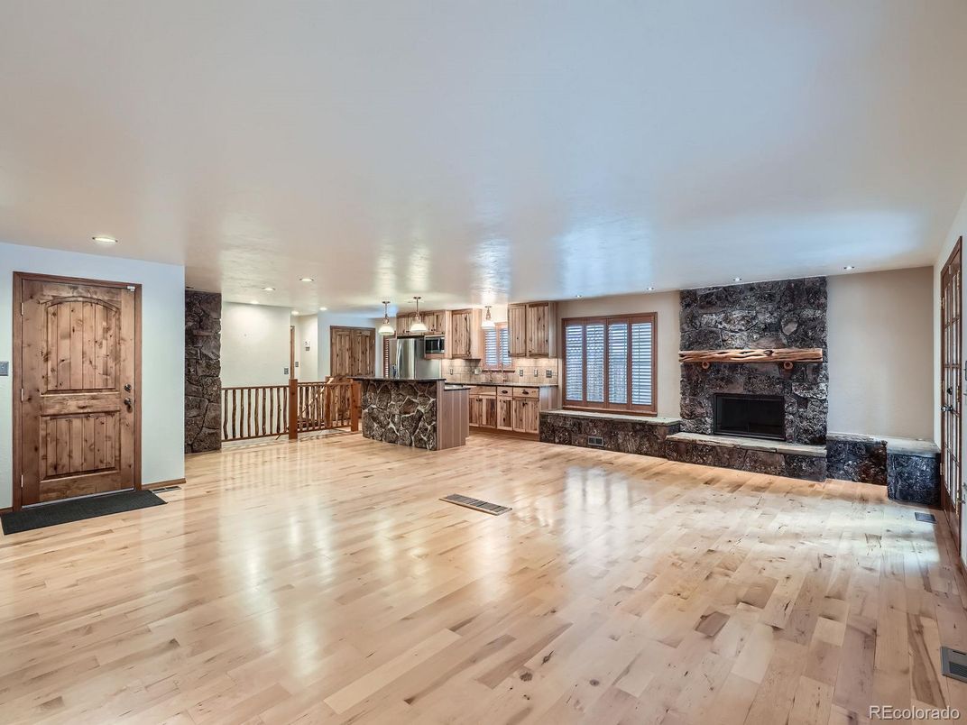 Empty room, Fireplace, Interior, Kitchen, Recessed Lighting, Wood Texture Flooring