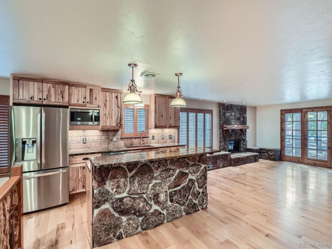 Fireplace, Interior, Kitchen, Pendant Lights, Stainless Steel Appliances, Wood Texture Flooring