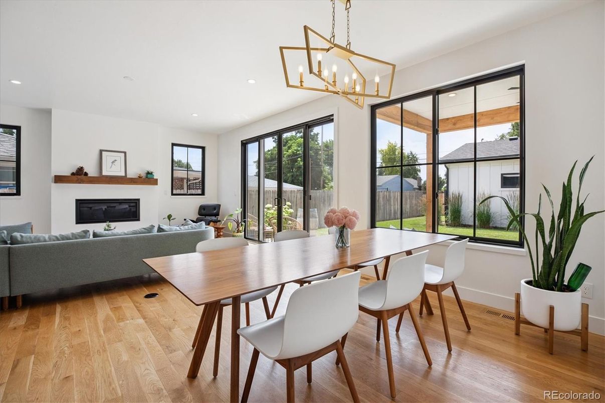 Dining room, Fireplace, Interior, Living room, Pendant Lights, Recessed Lighting, Wood Texture Flooring