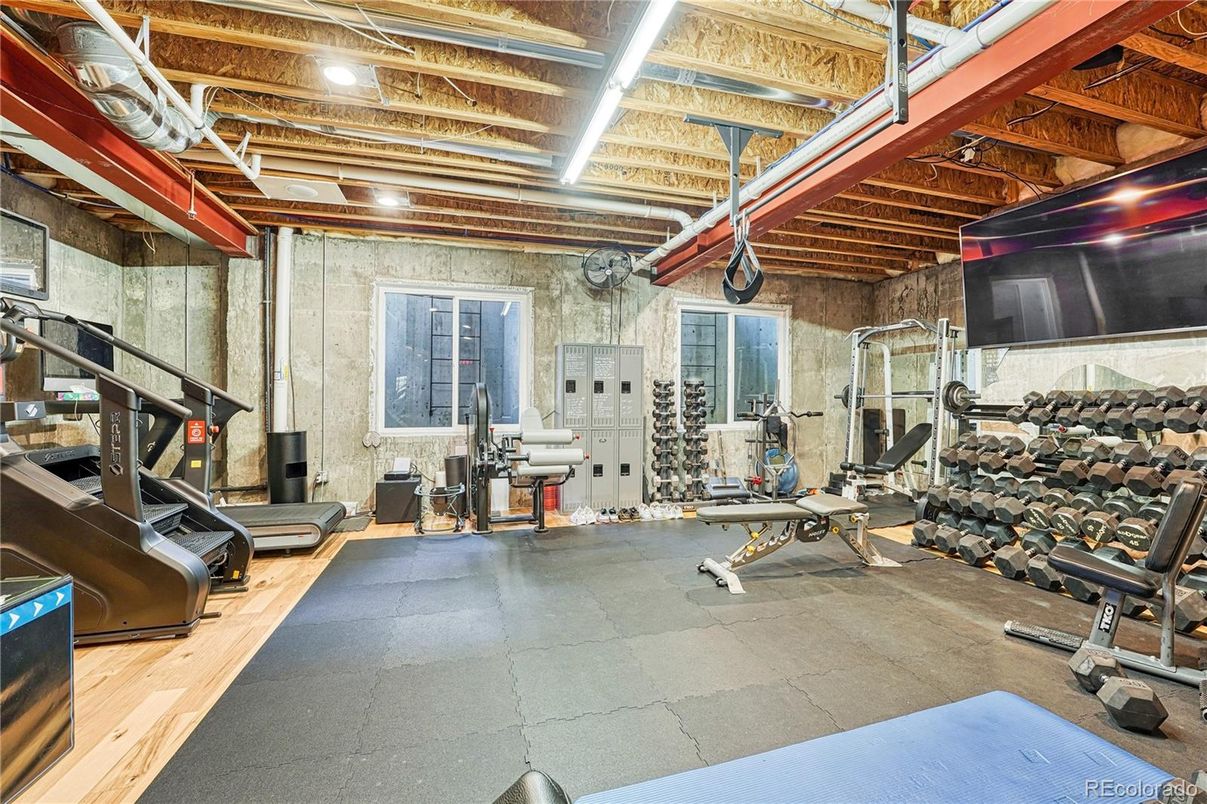 Fitness Equipment, Gym, Interior, Stone Walls, Wooden Beams, Wood Texture Flooring