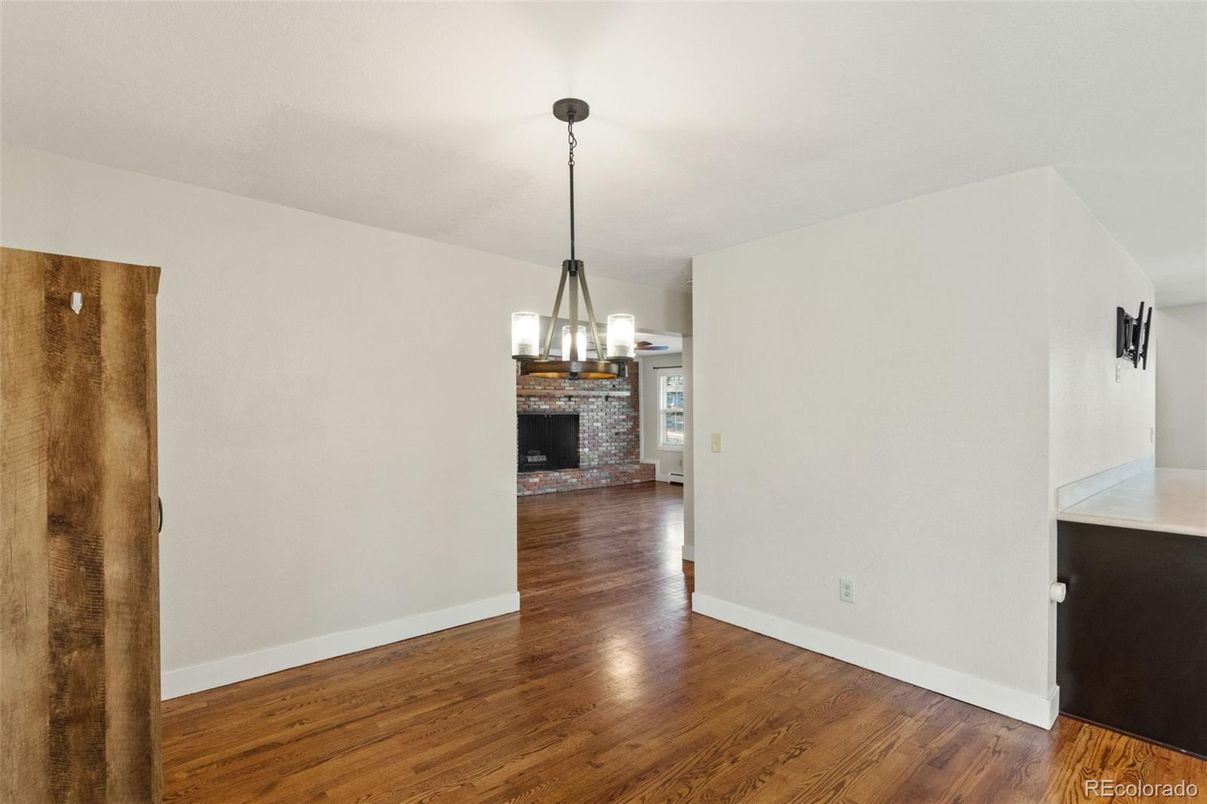 Empty room, Fireplace, Interior, Pendant Lights, Wood Texture Flooring