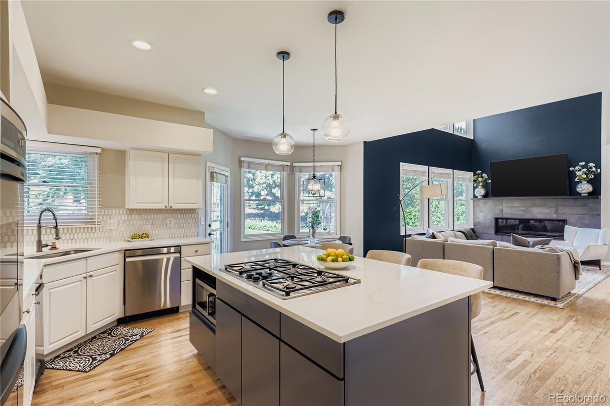 Fireplace, Interior, Kitchen, Living room, Pendant Lights, Recessed Lighting, Stainless Steel Appliances, Wood Texture Flooring