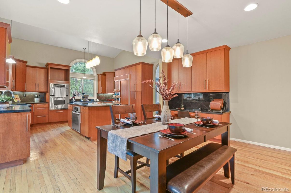Dining room, Interior, Kitchen, Pendant Lights, Recessed Lighting, Stainless Steel Appliances, Wood Texture Flooring