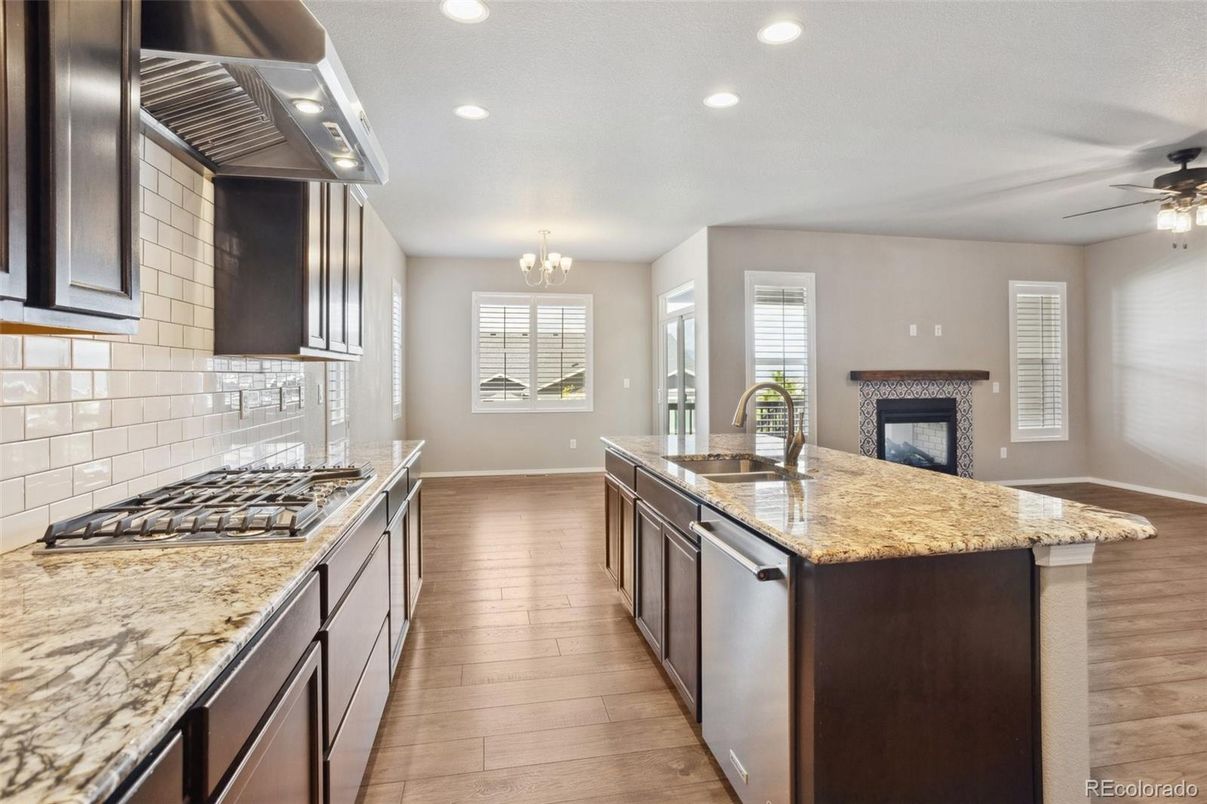 Chandelier, Fireplace, Interior, Kitchen, Recessed Lighting, Wood Texture Flooring