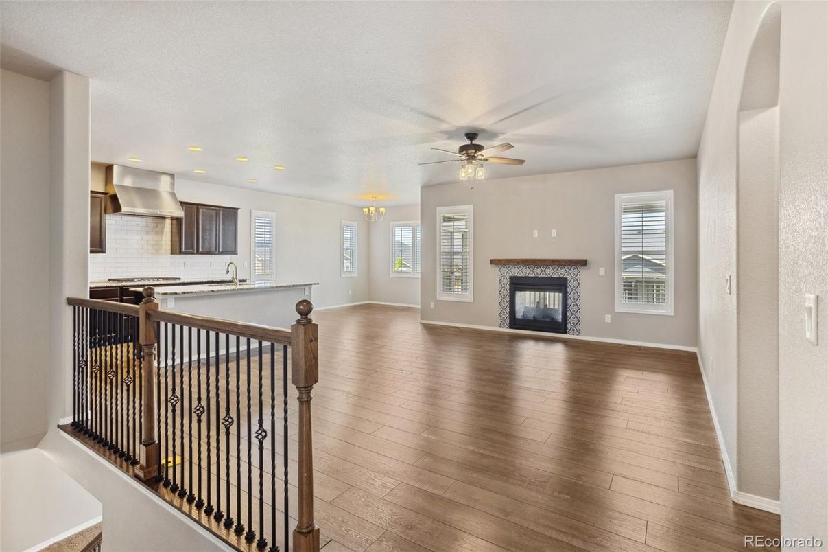 Empty room, Fireplace, Interior, Kitchen, Recessed Lighting, Wood Texture Flooring