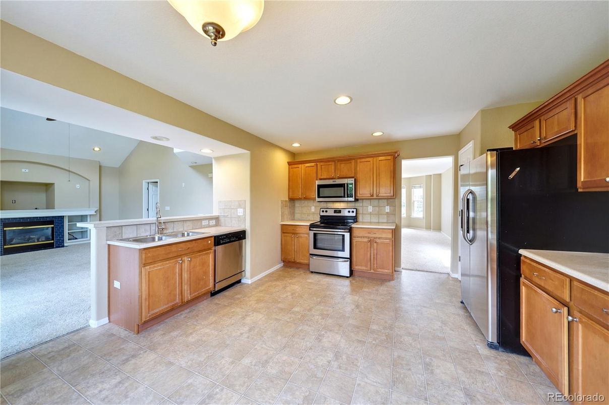 Fireplace, Interior, Kitchen, Recessed Lighting, Stainless Steel Appliances