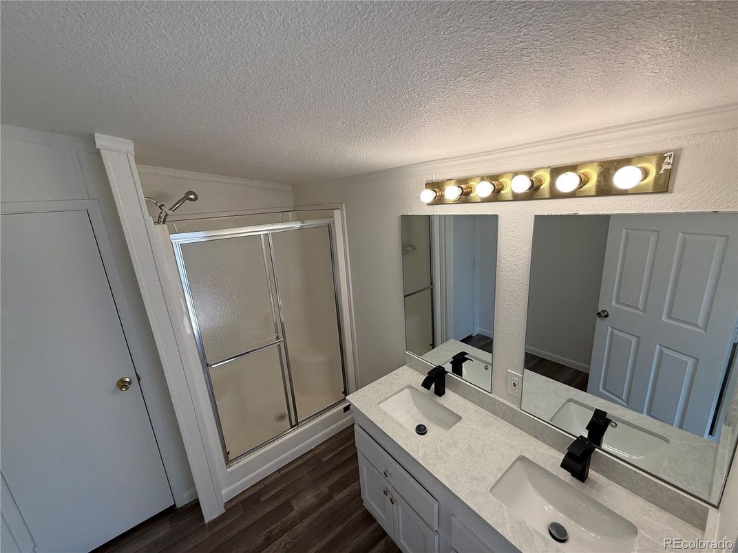 Bathroom, Dual Sink Vanities, Glass Shower, Interior, Wood Texture Flooring