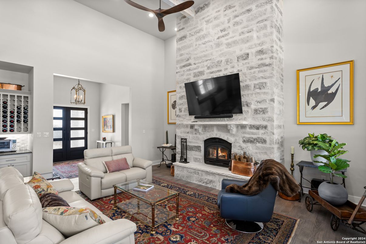 Fireplace, Interior, Living room, Pendant Lights, Recessed Lighting, Stone Walls, Wood Texture Flooring