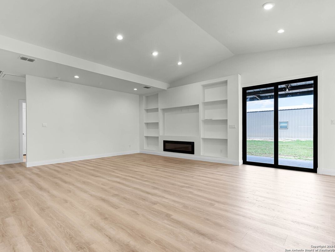 Empty room, Fireplace, Interior, Recessed Lighting, Wood Texture Flooring