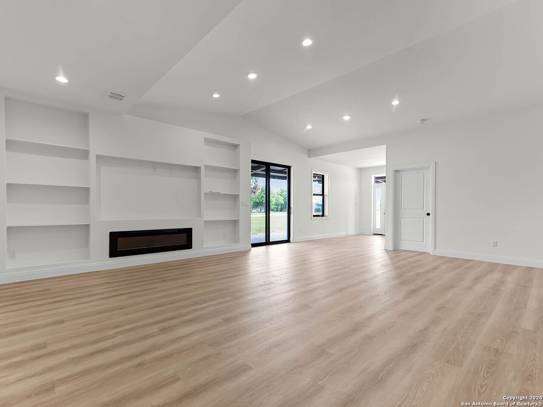 Empty room, Fireplace, Interior, Recessed Lighting, Wood Texture Flooring