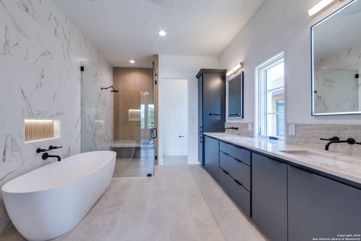 Bathroom, Dual Sink Vanities, Free Standing Baths, Glass Shower, Interior, Marble Walls, Recessed Lighting