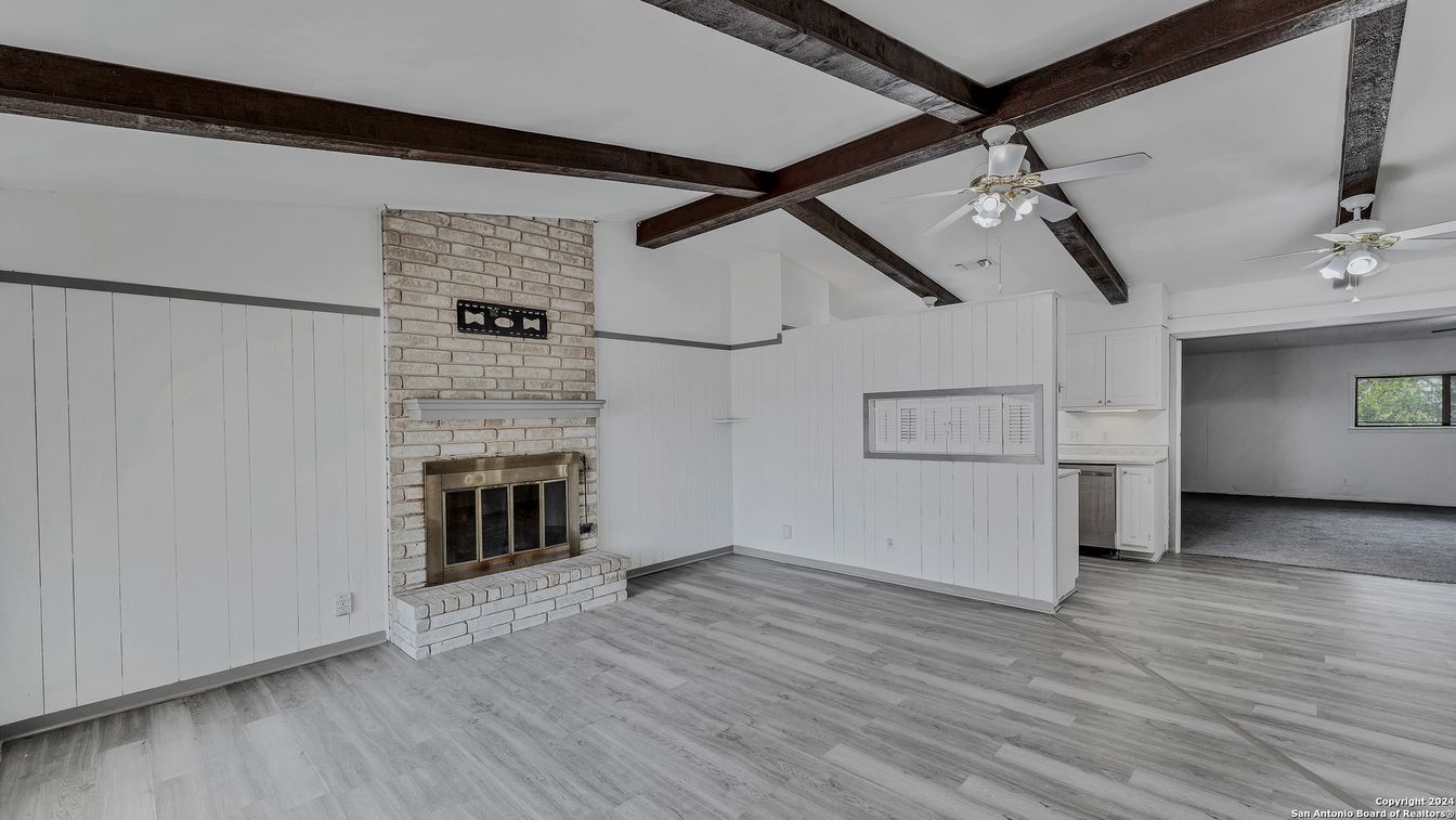 Empty room, Fireplace, Interior, Stone Walls, Wooden Beams, Wood Texture Flooring
