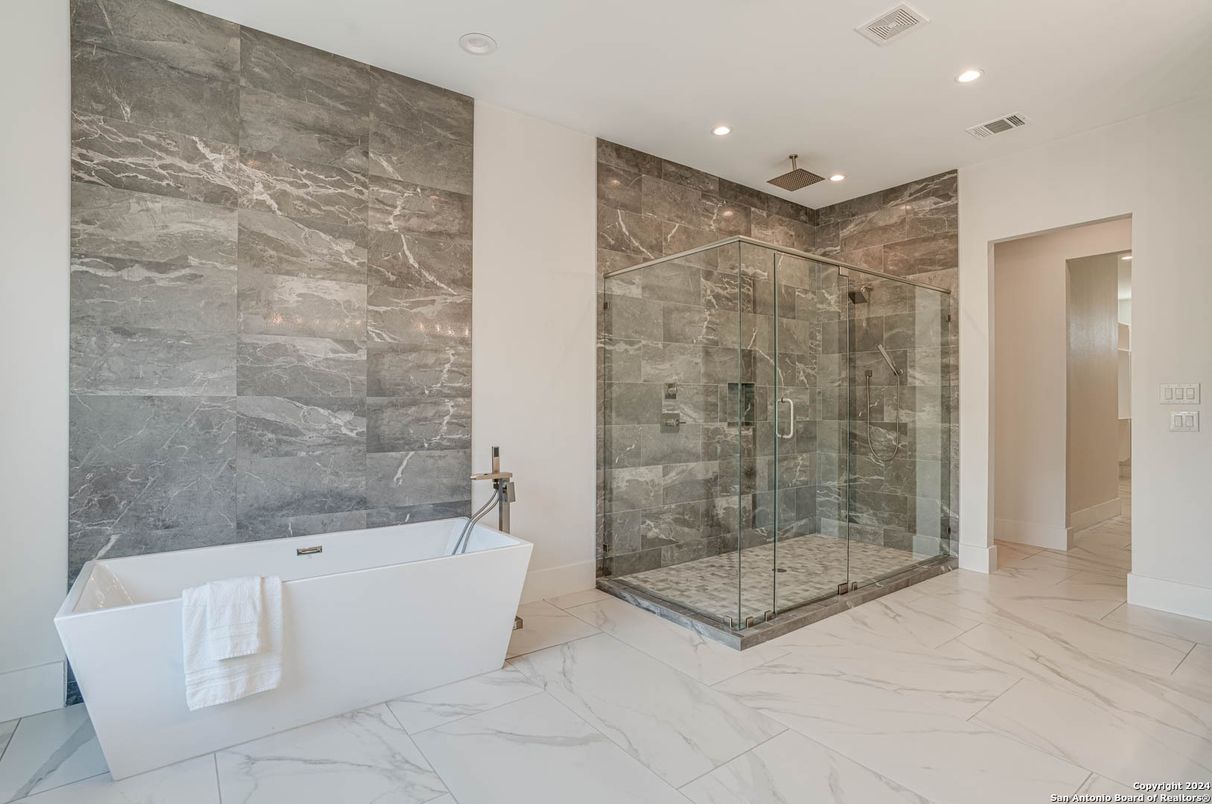 Bathroom, Free Standing Baths, Glass Shower, Interior, Marble, Marble Walls, Recessed Lighting
