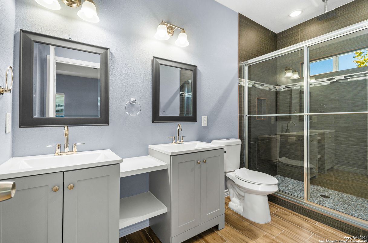 Bathroom, Dual Sink Vanities, Glass Shower, Interior, Recessed Lighting, Wood Texture Flooring