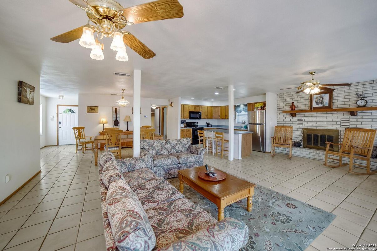 Dining room, Fireplace, Interior, Kitchen, Living room, Stainless Steel Appliances, Stone Walls