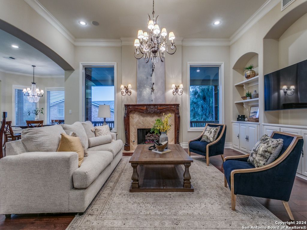 Chandelier, Dining room, Fireplace, Interior, Living room, Recessed Lighting, Wood Texture Flooring