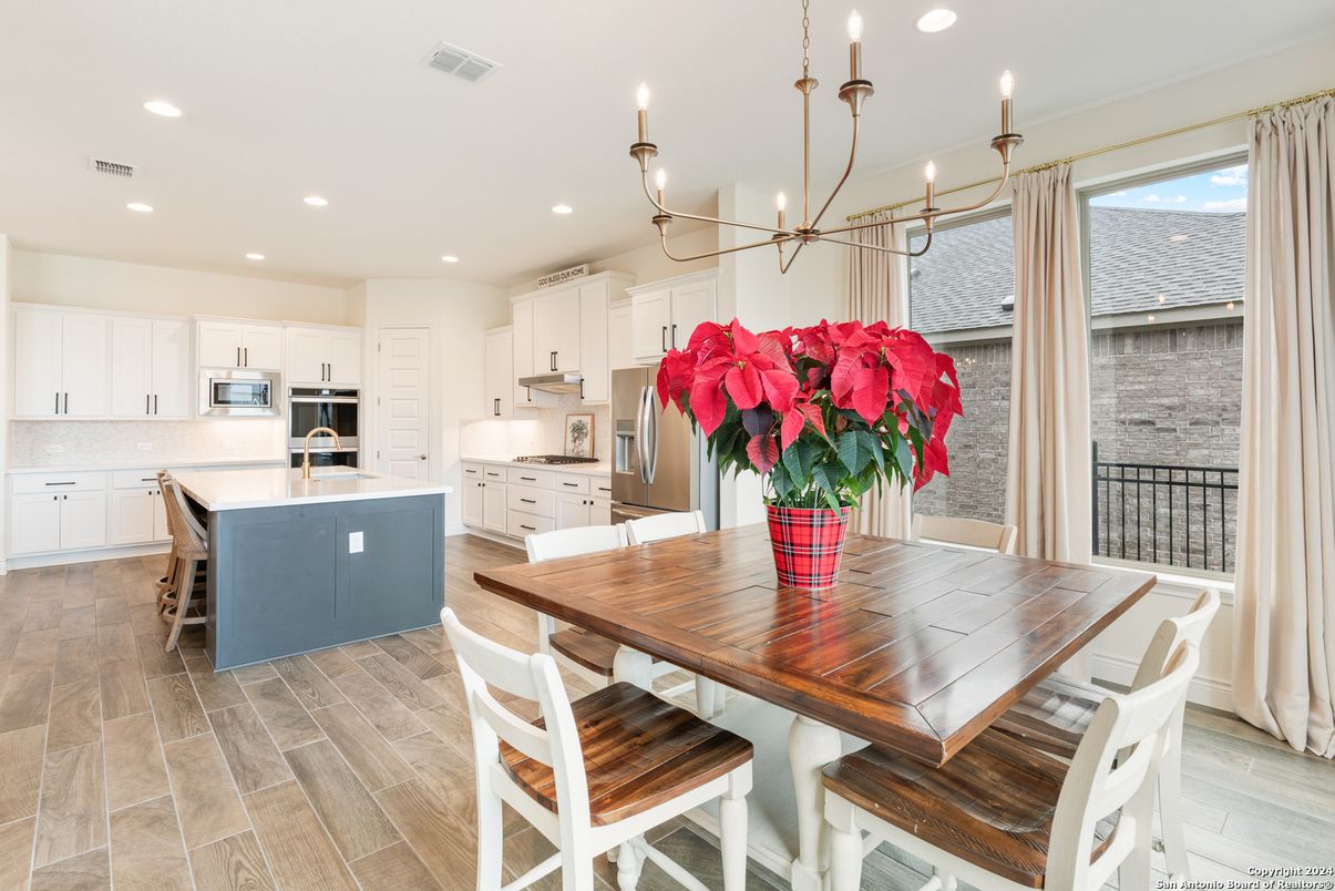Dining room, Interior, Kitchen, Pendant Lights, Recessed Lighting, Stainless Steel Appliances, Wood Texture Flooring