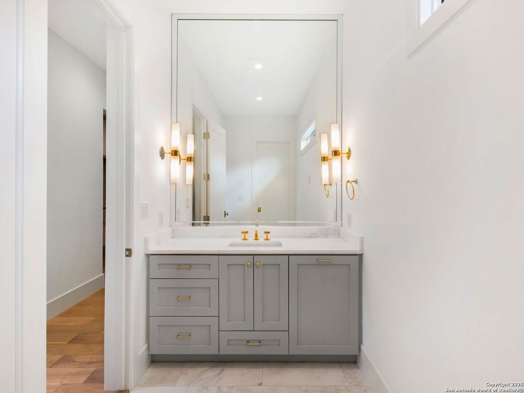 Bathroom, Dual Sink Vanities, Interior, Marble, Recessed Lighting, Wood Texture Flooring