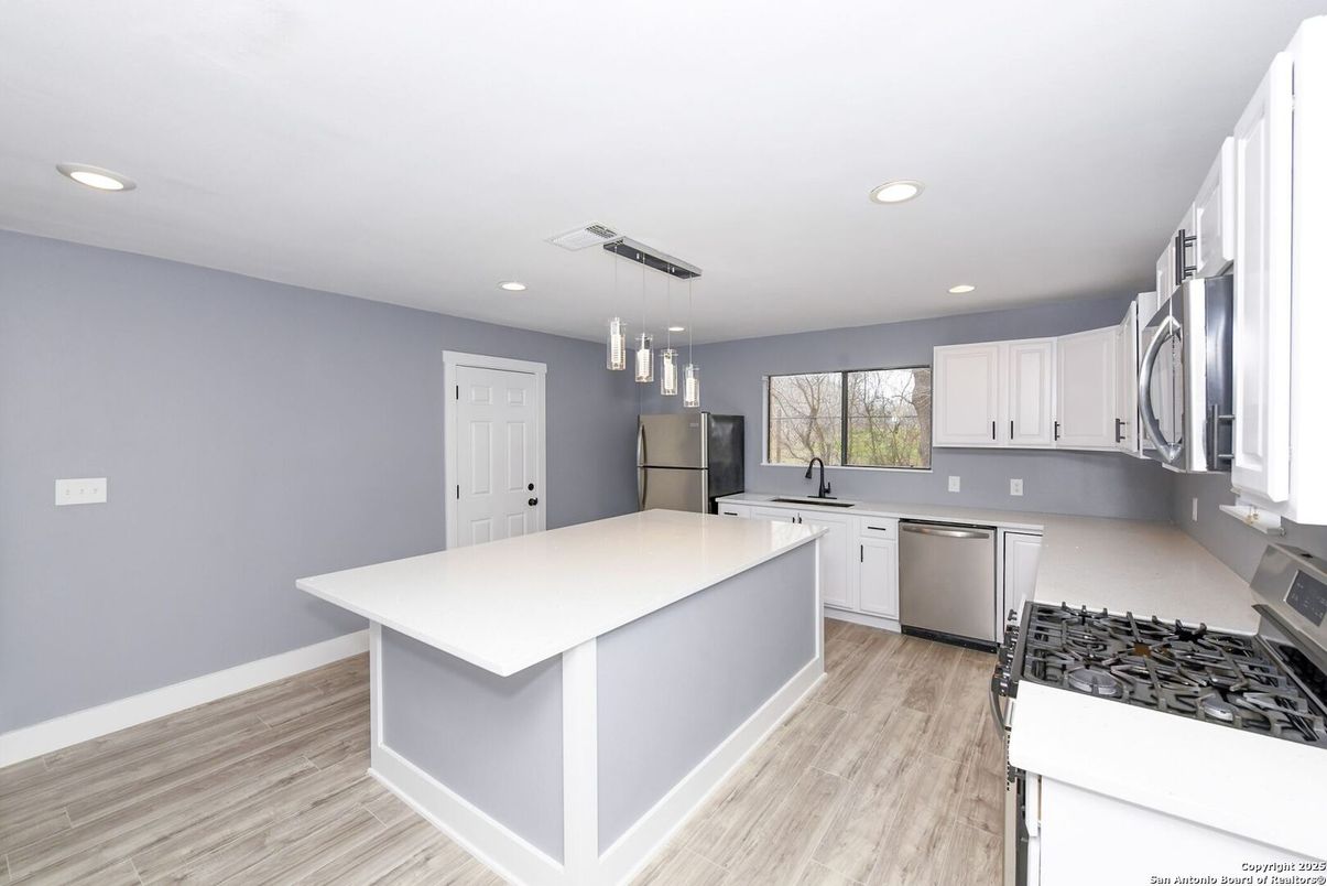 Interior, Kitchen, Pendant Lights, Recessed Lighting, Stainless Steel Appliances, Wood Texture Flooring