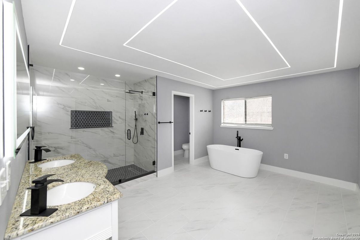 Bathroom, Dual Sink Vanities, Free Standing Baths, Glass Shower, Interior, Marble, Marble Walls, Recessed Lighting