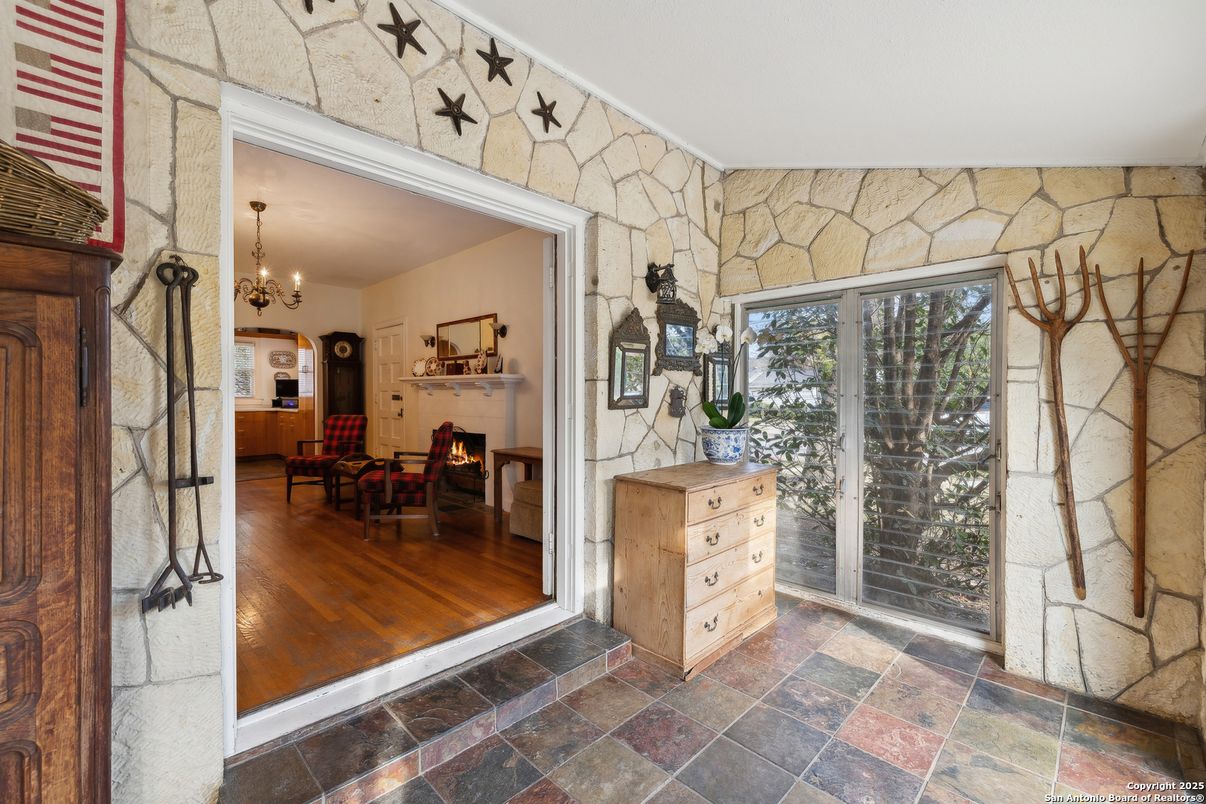 Chandelier, Dining room, Fireplace, Interior, Stone Walls, Wood Texture Flooring