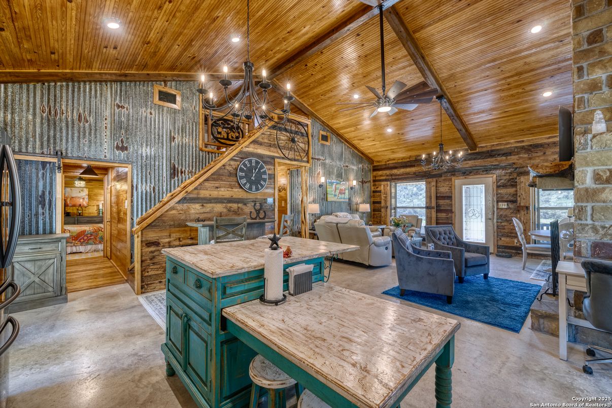 Chandelier, Dining room, Fireplace, Interior, Living room, Recessed Lighting, Stone Walls, Wooden Beams, Wooden Ceilings, Wood Texture Flooring, Wooden Walls