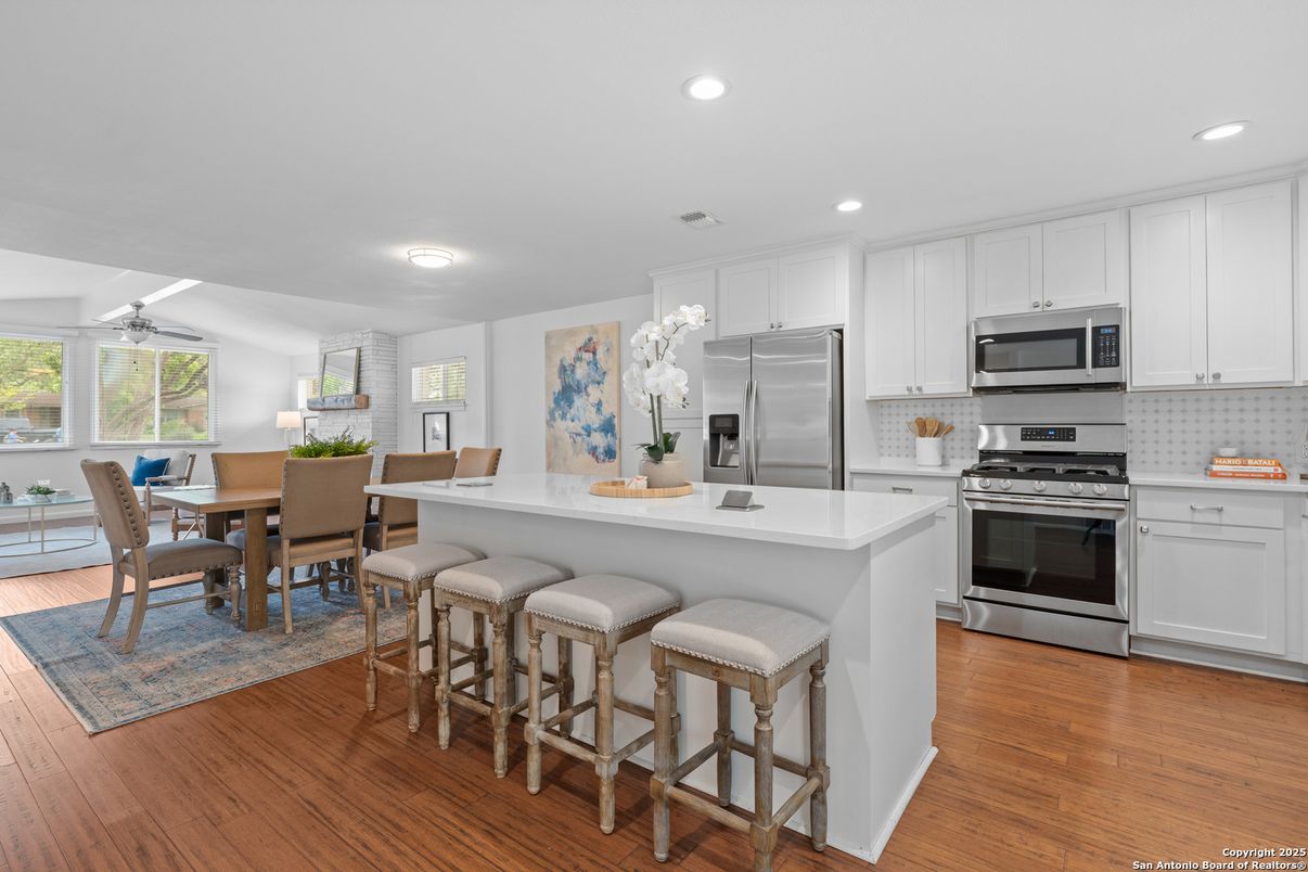 Dining room, Interior, Kitchen, Recessed Lighting, Stainless Steel Appliances, Wood Texture Flooring