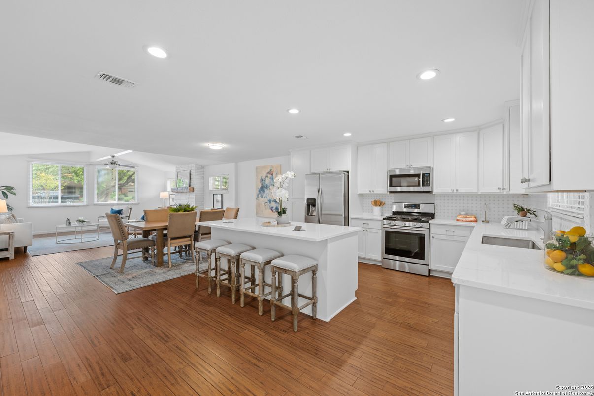Dining room, Interior, Kitchen, Living room, Recessed Lighting, Stainless Steel Appliances, Wood Texture Flooring