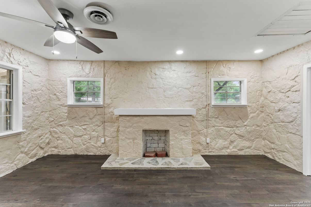 Fireplace, Interior, Marble Walls, Recessed Lighting, Stone Walls, Wood Texture Flooring