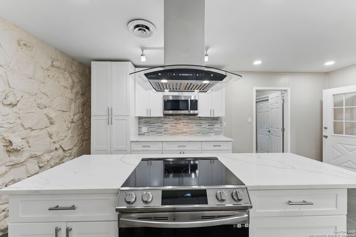 Interior, Kitchen, Recessed Lighting, Stainless Steel Appliances, Stone Walls