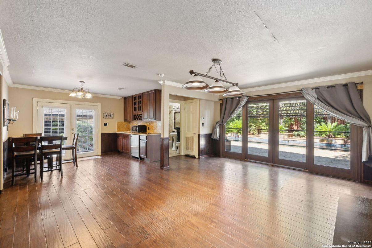 Chandelier, Dining room, Interior, Kitchen, Pendant Lights, Stainless Steel Appliances, Wood Texture Flooring