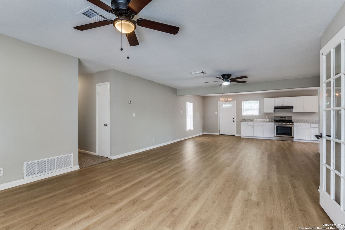 Empty room, Interior, Kitchen, Stainless Steel Appliances, Wood Texture Flooring