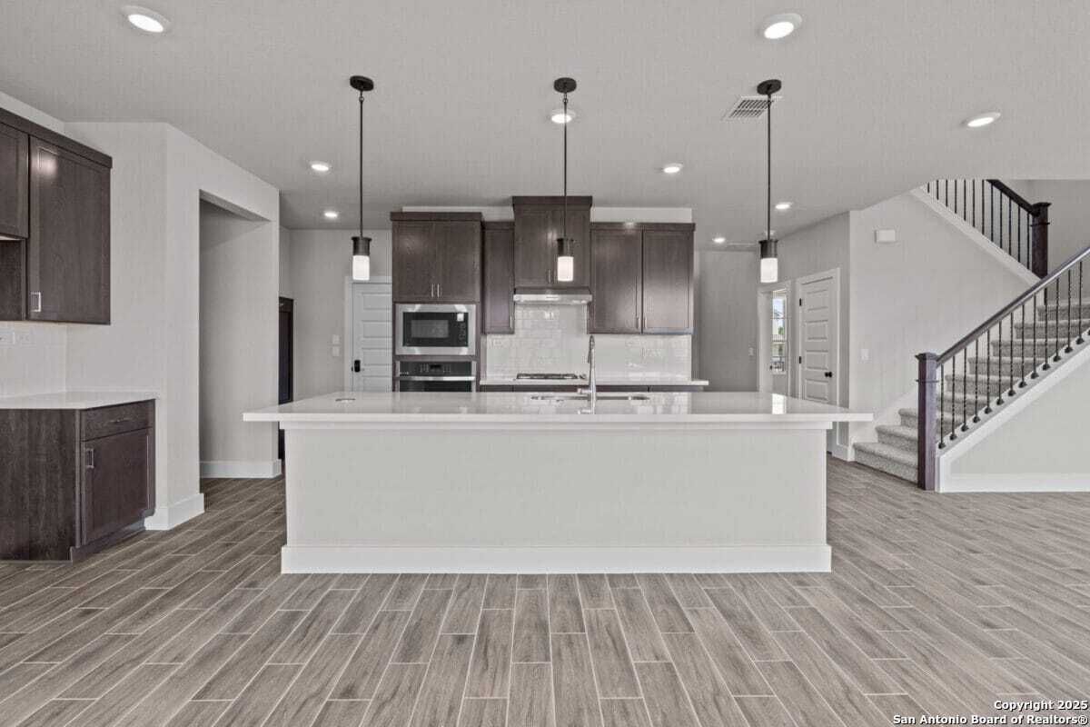 Interior, Kitchen, Pendant Lights, Recessed Lighting, Stainless Steel Appliances, Wood Texture Flooring