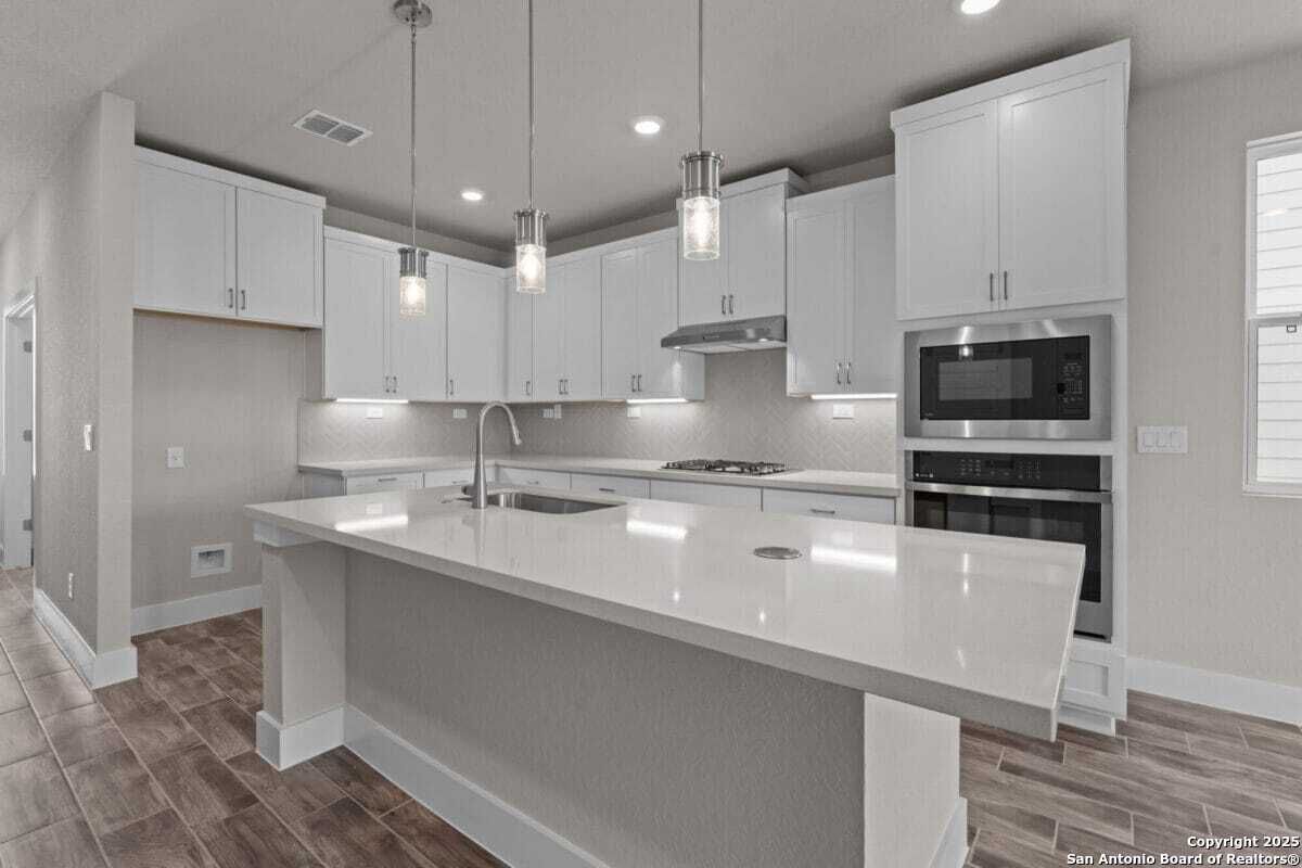 Interior, Kitchen, Pendant Lights, Recessed Lighting, Stainless Steel Appliances, Wood Texture Flooring