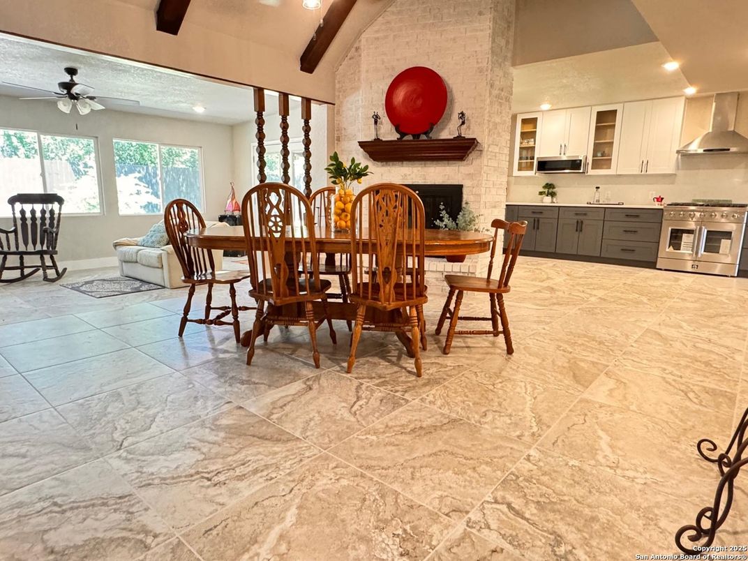 Dining room, Fireplace, Interior, Kitchen, Recessed Lighting, Stainless Steel Appliances, Stone Walls, Wooden Beams