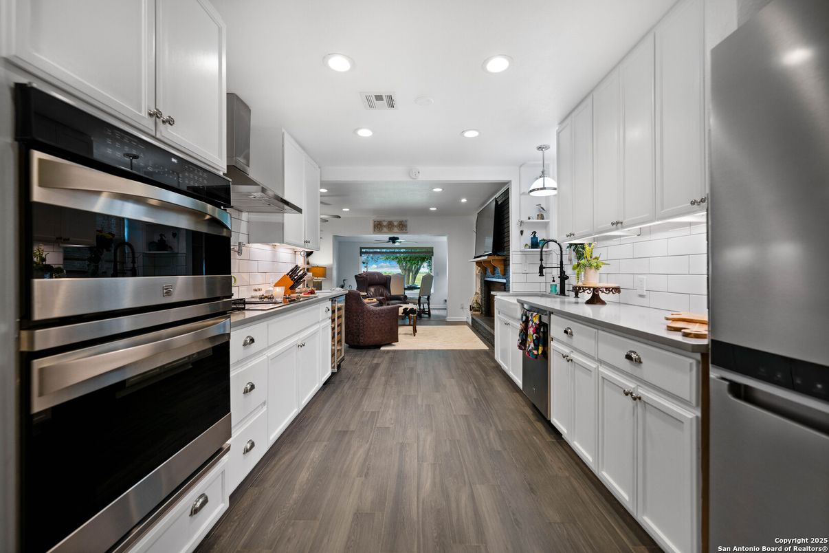 Dining room, Interior, Kitchen, Pendant Lights, Recessed Lighting, Stainless Steel Appliances, Wood Texture Flooring