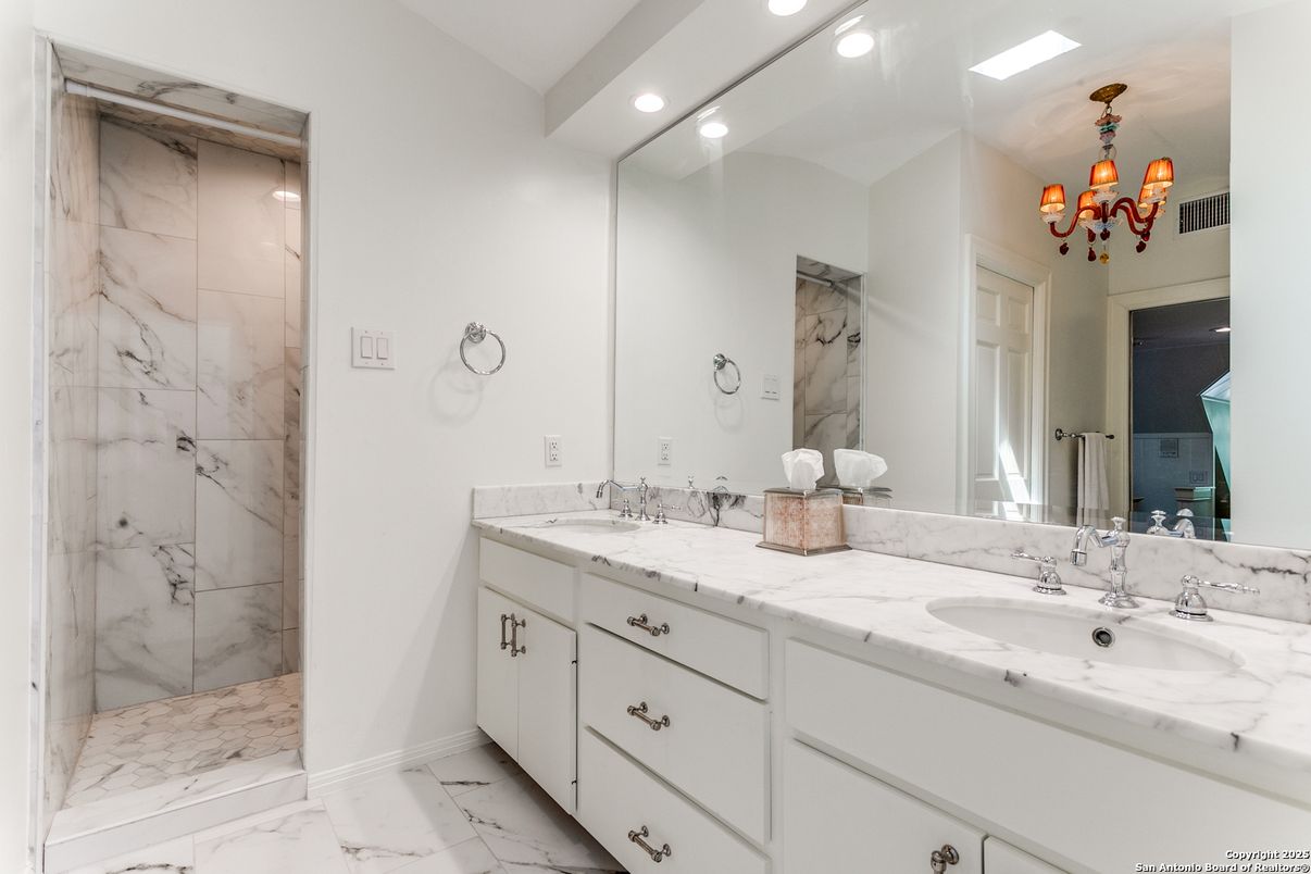 Bathroom, Chandelier, Dual Sink Vanities, Interior, Marble, Marble Walls, Recessed Lighting