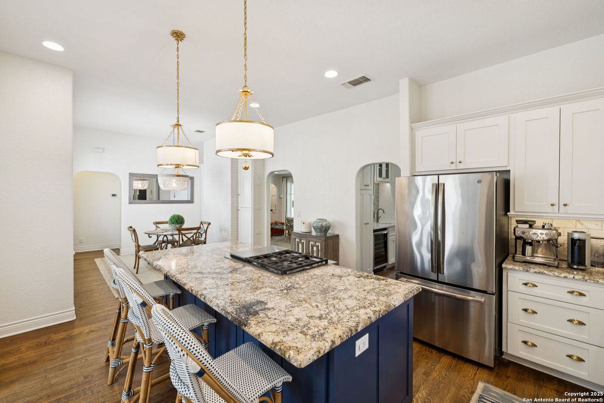 Dining room, Interior, Kitchen, Pendant Lights, Recessed Lighting, Stainless Steel Appliances, Wood Texture Flooring