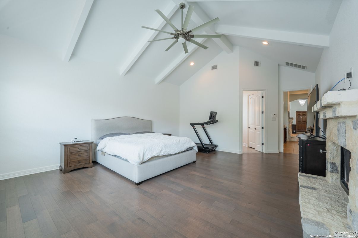 Bedroom, Fireplace, Interior, Recessed Lighting, Wood Texture Flooring