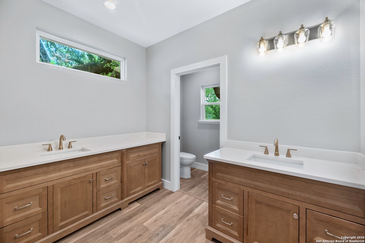 Bathroom, Dual Sink Vanities, Interior, Recessed Lighting, Wood Texture Flooring