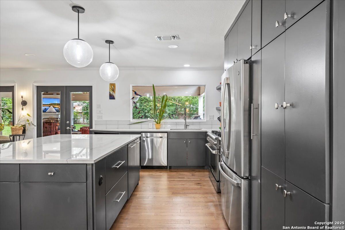 Interior, Kitchen, Pendant Lights, Recessed Lighting, Stainless Steel Appliances, Wood Texture Flooring