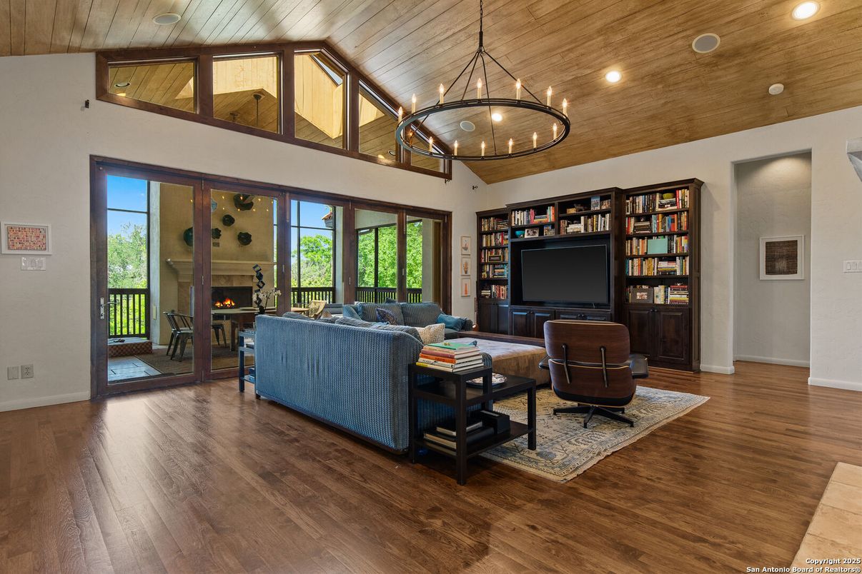Chandelier, Fireplace, Interior, Living room, Pendant Lights, Recessed Lighting, Wooden Ceilings, Wood Texture Flooring