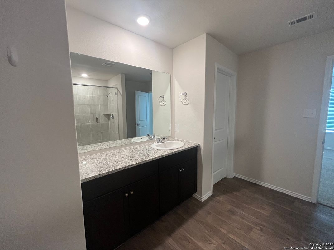 Bathroom, Dual Sink Vanities, Interior, Recessed Lighting, Wood Texture Flooring